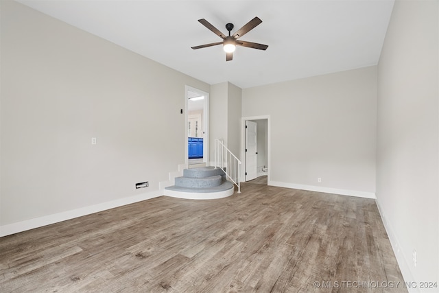 spare room featuring ceiling fan and wood-type flooring