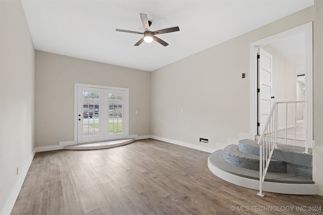 unfurnished room featuring hardwood / wood-style floors and ceiling fan