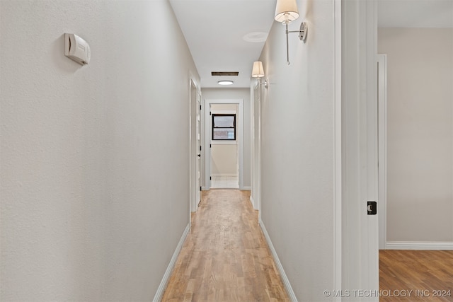 corridor featuring light hardwood / wood-style flooring