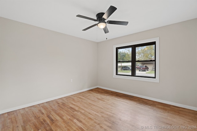 spare room featuring ceiling fan and light wood-type flooring