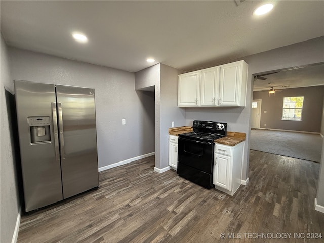 kitchen with white cabinets, black range with electric cooktop, ceiling fan, wood counters, and stainless steel fridge