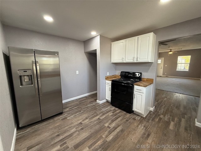 kitchen featuring black range with electric cooktop, stainless steel fridge, butcher block counters, white cabinetry, and ceiling fan