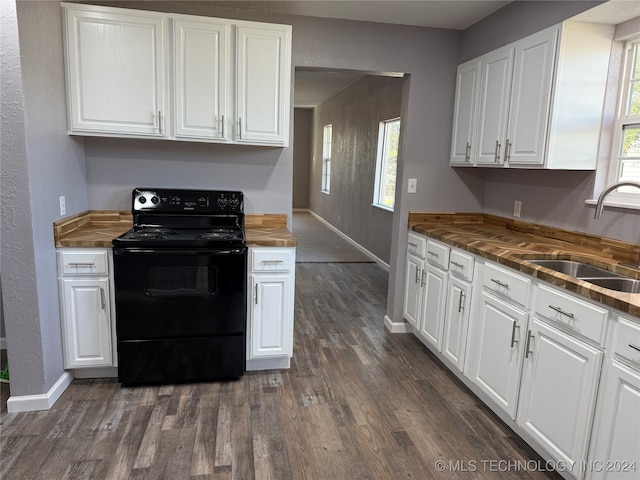 kitchen featuring white cabinets, black range with electric cooktop, sink, and dark hardwood / wood-style flooring