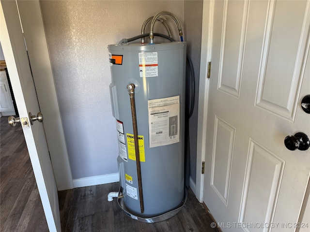utility room featuring water heater
