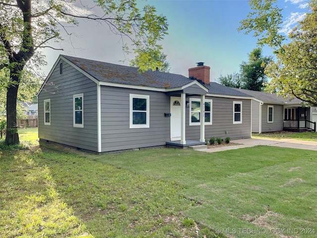 ranch-style home with a front yard