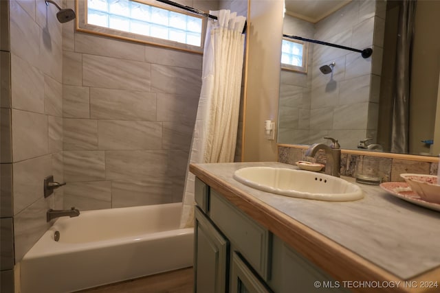 bathroom featuring shower / bath combo, vanity, and wood-type flooring