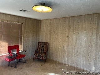 sitting room with wooden walls