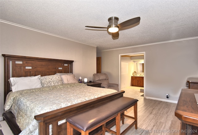 bedroom featuring a textured ceiling, ceiling fan, light wood-type flooring, and ornamental molding