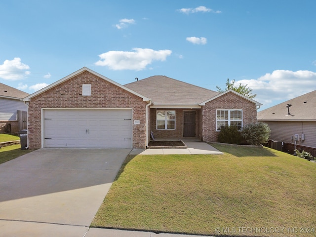 single story home featuring a garage and a front yard