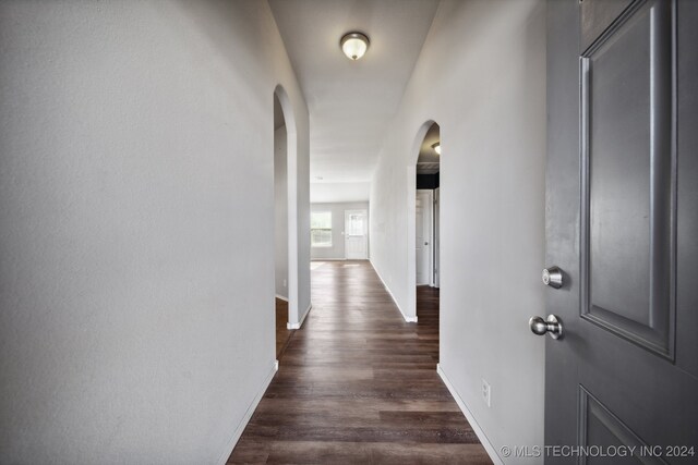 hall with dark hardwood / wood-style floors