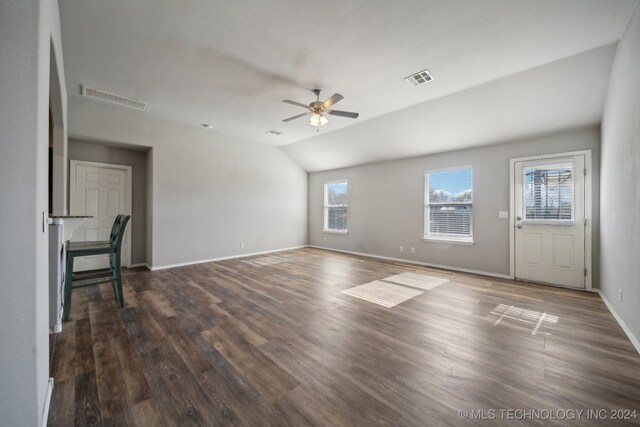 unfurnished living room with dark hardwood / wood-style floors, ceiling fan, and vaulted ceiling