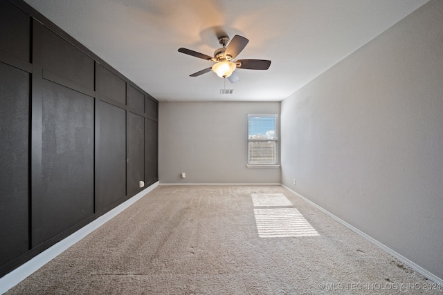 unfurnished bedroom featuring ceiling fan, a closet, and light colored carpet