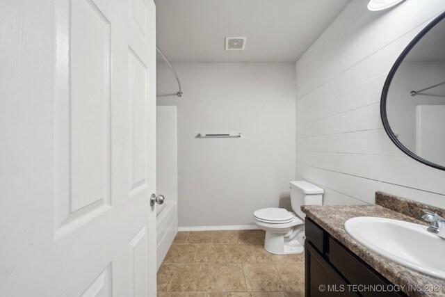 full bathroom with vanity, toilet, and shower / washtub combination