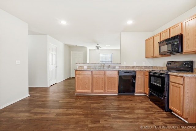 kitchen featuring sink, black appliances, kitchen peninsula, light brown cabinetry, and dark hardwood / wood-style floors