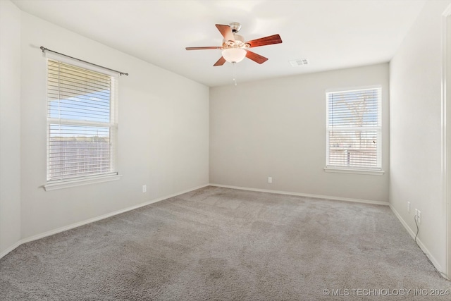 empty room with light carpet and ceiling fan