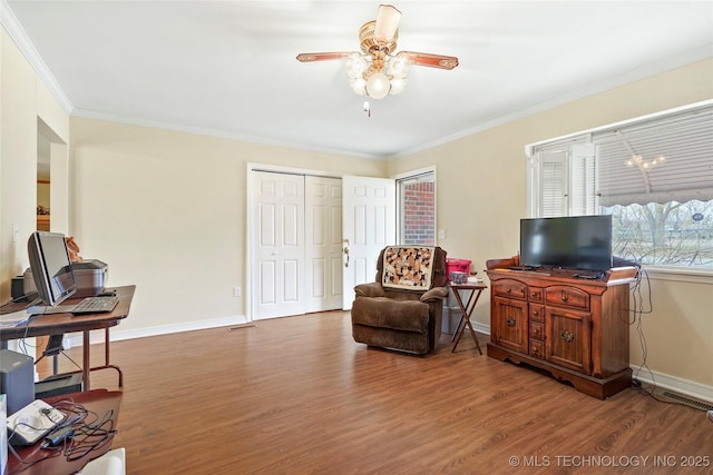 living area with ceiling fan, crown molding, and hardwood / wood-style flooring