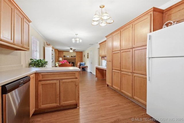 kitchen with pendant lighting, dishwasher, white fridge, kitchen peninsula, and light wood-type flooring