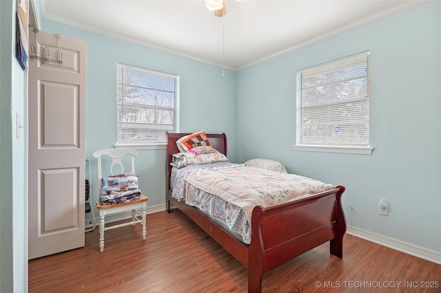 bedroom with ceiling fan, crown molding, and hardwood / wood-style floors