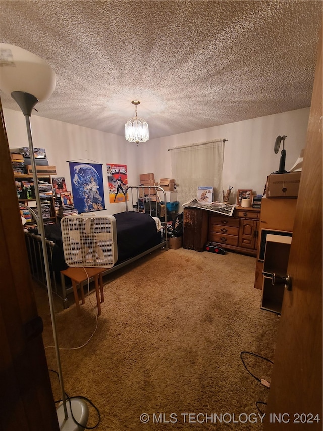 carpeted bedroom with a textured ceiling and a notable chandelier