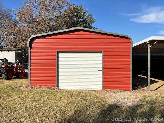 garage with a lawn