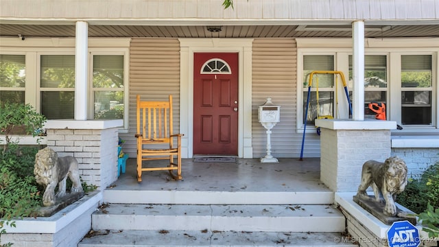 entrance to property with a porch