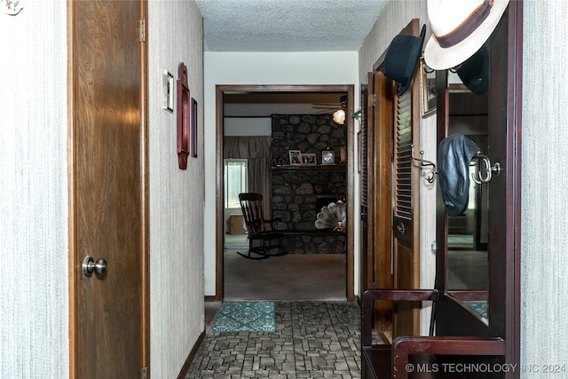 corridor with a textured ceiling