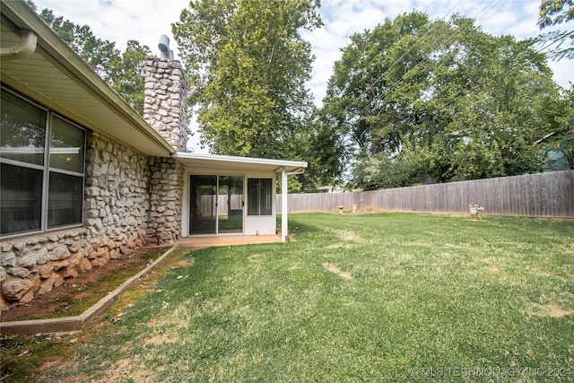 view of yard featuring a sunroom