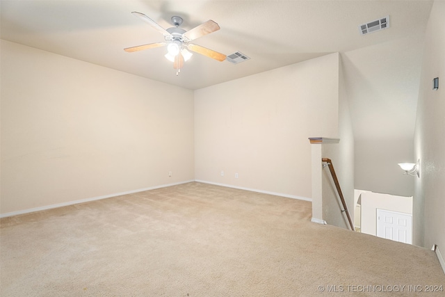 carpeted empty room with ceiling fan