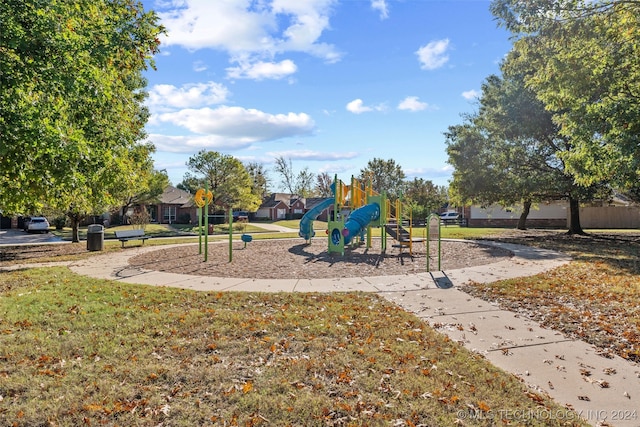 view of playground featuring a lawn