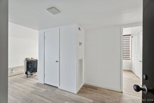 corridor featuring light hardwood / wood-style flooring