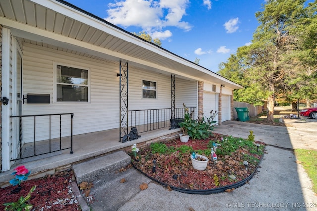 view of front of house with a garage and covered porch