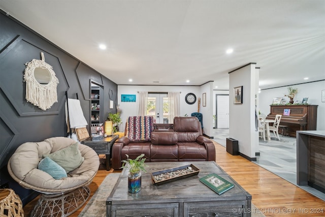 living room with light hardwood / wood-style floors and french doors