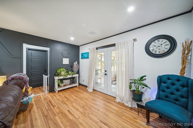 interior space with wood-type flooring and french doors