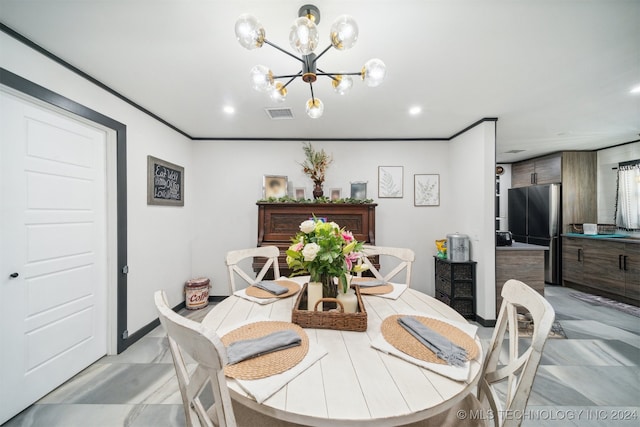 dining area featuring an inviting chandelier and ornamental molding