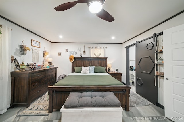 bedroom with crown molding, a barn door, and ceiling fan