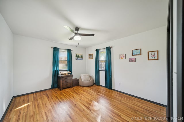 unfurnished bedroom with hardwood / wood-style flooring and ceiling fan