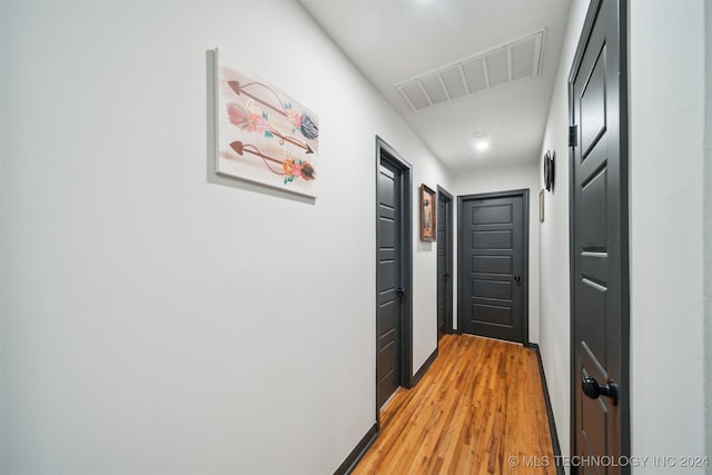 hall with light hardwood / wood-style flooring