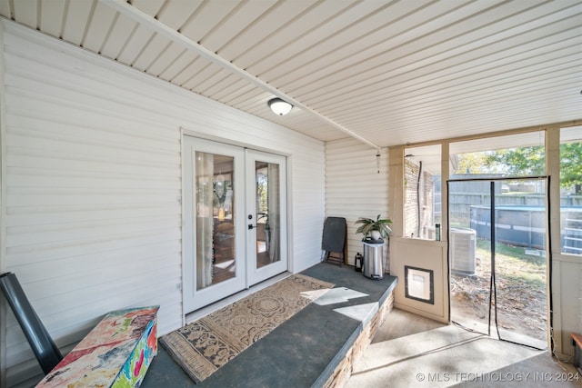 sunroom / solarium featuring french doors