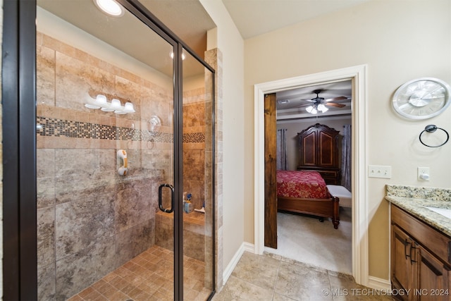 bathroom featuring vanity and a shower with door