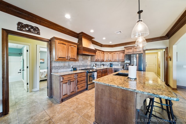 kitchen featuring hanging light fixtures, custom range hood, sink, a large island, and stainless steel appliances