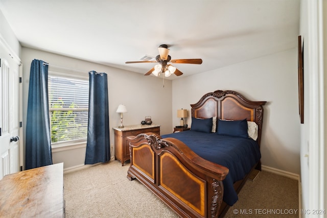 carpeted bedroom with ceiling fan