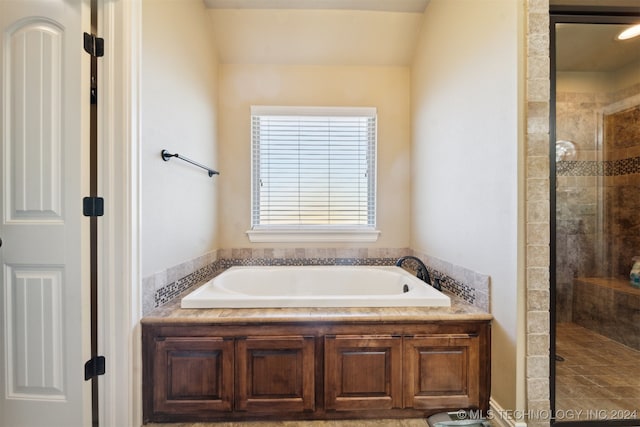 bathroom featuring plus walk in shower