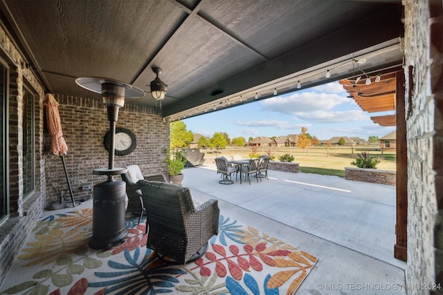 view of patio featuring ceiling fan