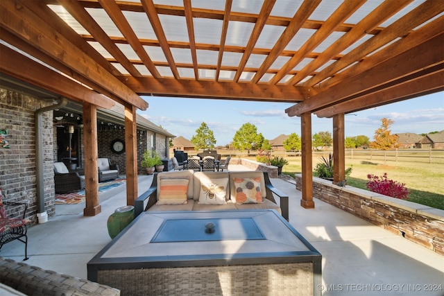 view of patio featuring an outdoor kitchen, a pergola, and an outdoor hangout area