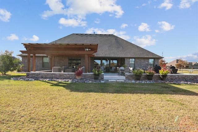 rear view of property featuring a lawn, a patio, and a pergola