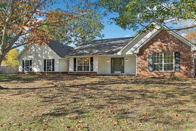 ranch-style house with a front yard