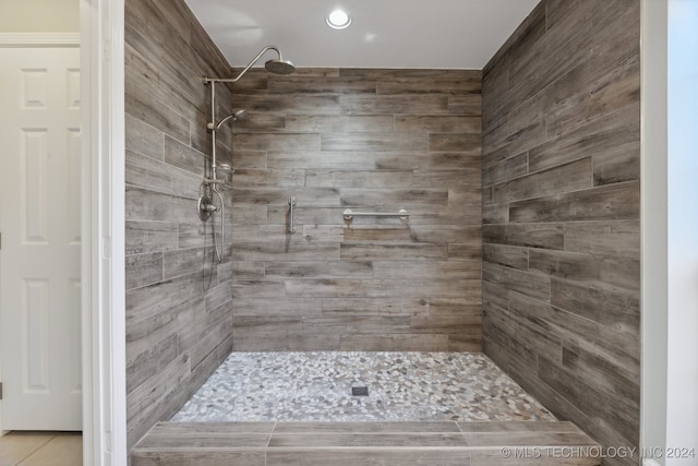 bathroom with a tile shower