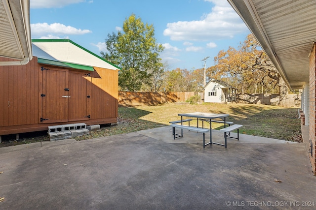 view of patio / terrace featuring a storage unit