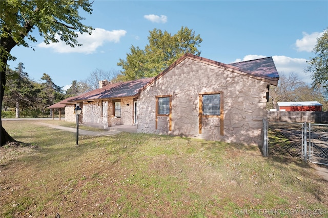 view of home's exterior featuring a lawn