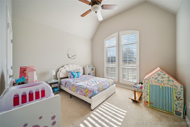 bedroom with vaulted ceiling, light carpet, and ceiling fan